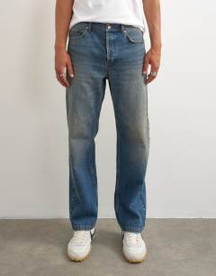 Model wearing Rigid straight fit jean with tint in mid wash