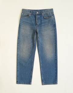 Model wearing Rigid straight fit jean with tint in mid wash
