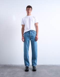 Model wearing Rigid straight jean in mid wash