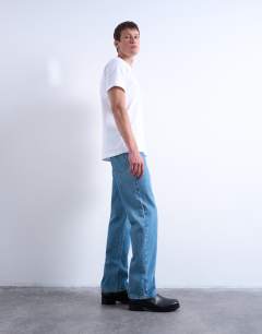 Model wearing Rigid straight jean in mid wash