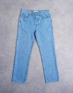 Model wearing Rigid straight jean in mid wash