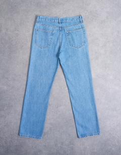 Model wearing Rigid straight jean in mid wash