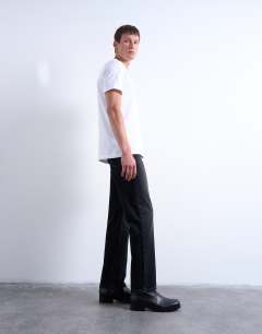 Model wearing Rigid straight jean in washed black