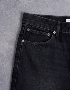 Model wearing Rigid straight jean in washed black