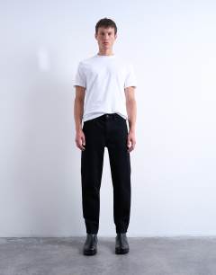 Model wearing Rigid taper jean in black