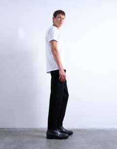 Model wearing Rigid taper jean in black
