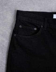 Model wearing Rigid taper jean in black