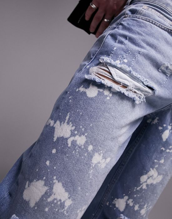 https://images.asos-media.com/products/topman-rip-and-bleach-relaxed-jeans-in-mid-wash/201805551-3?$n_550w$&wid=550&fit=constrain
