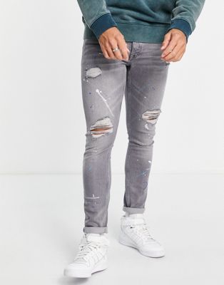 Topman rip and repair paint splat stretch skinny jeans in grey