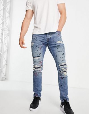 Topman stretch skinny rip and repair paint splat jeans in mid wash blue