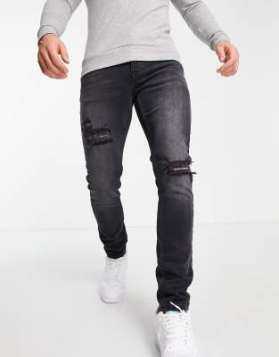 Topman rip stretch skinny jeans in washed black