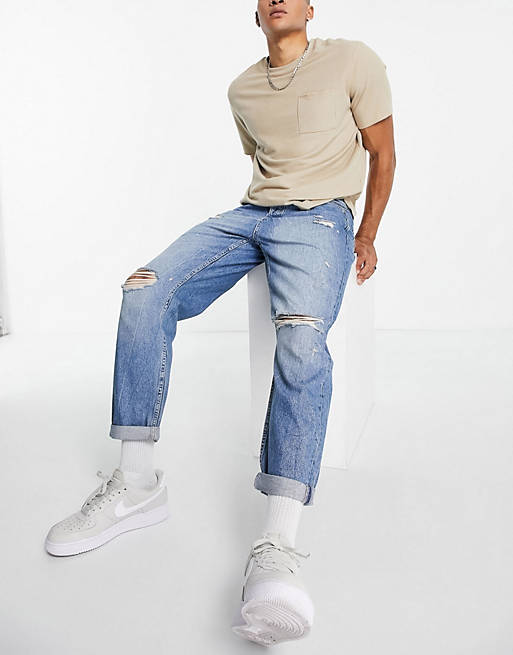Topman ripped relaxed jeans in mid wash