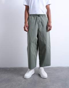 Model wearing Ripstop barrel trousers in khaki