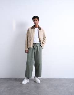 Model wearing Ripstop barrel trousers in khaki