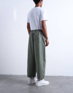 Model wearing Ripstop barrel trousers in khaki