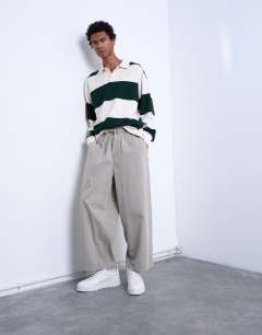 Model wearing Ripstop barrel trousers in stone