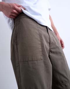 Model wearing Ripstop taper leg trouser with seam detail in khaki