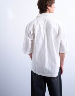 Model wearing Short sleeve boxy textured shirt in stone
