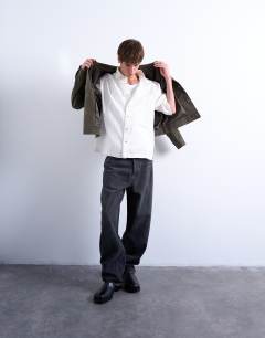 Model wearing Short sleeve boxy textured shirt in stone
