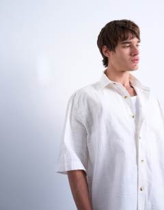 Model wearing Short sleeve boxy textured shirt in stone