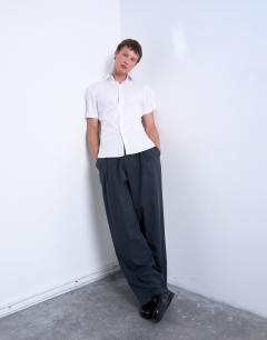 Model wearing Short sleeve formal slim stretch fit shirt in white