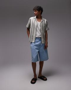 Model wearing Short sleeve revere stripe shirt in green and white