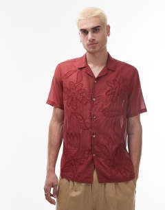 Model wearing Short sleeve sheer embroidered floral shirt in red