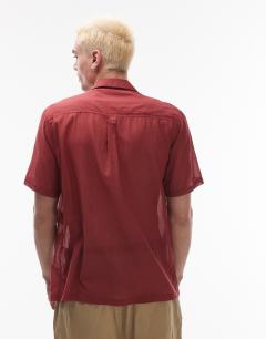 Model wearing Short sleeve sheer embroidered floral shirt in red