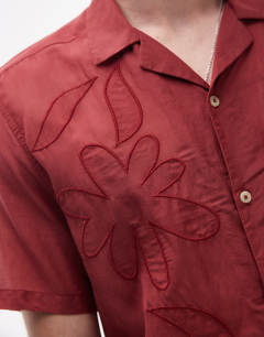 Model wearing Short sleeve sheer embroidered floral shirt in red