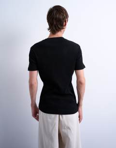 Model wearing Skinny fit ribbed t-shirt in black