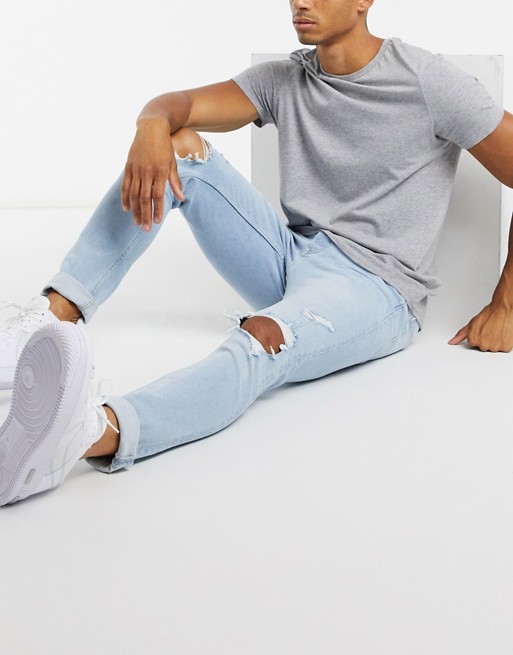 Topman  stretch skinny jeans with rips in bleach wash blue