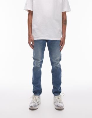 skinny jeans in mid wash blue