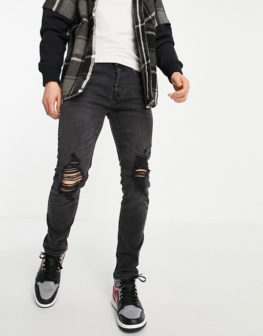 Topman stretch skinny jeans with rip in washed black