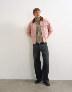 Model wearing Slim fit funnel neck twist jumper with double zip in brown
