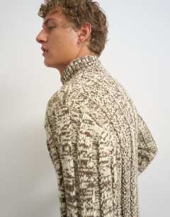Model wearing Slim fit funnel neck twist jumper with double zip in brown
