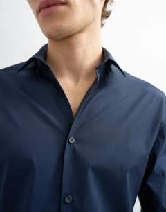 Model wearing Slim fit long sleeve formal stretch shirt in navy