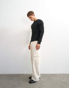 Model wearing Slim fit long sleeve rib henley t-shirt in black