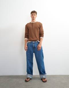 Model wearing Slim fit long sleeve rib henley t-shirt in brown