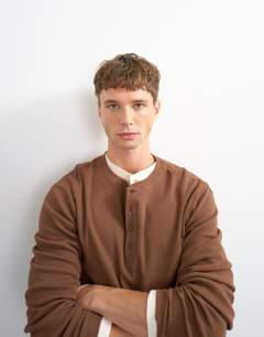Model wearing Slim fit long sleeve rib henley t-shirt in brown
