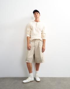 Model wearing Slim fit long sleeve rib henley t-shirt in ecru