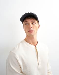 Model wearing Slim fit long sleeve rib henley t-shirt in ecru
