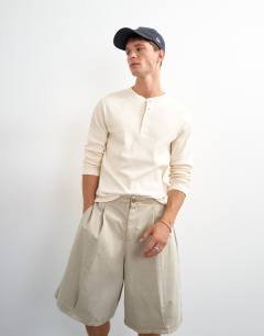Model wearing Slim fit long sleeve rib henley t-shirt in ecru