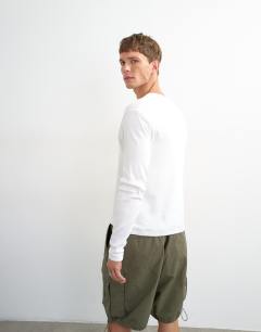 Model wearing Slim fit long sleeve rib henley t-shirt in white