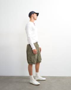 Model wearing Slim fit long sleeve rib henley t-shirt in white