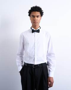 Model wearing Slim fit long sleeve tuxedo shirt with bib in white