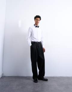 Model wearing Slim fit long sleeve tuxedo shirt with bib in white