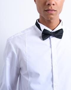 Model wearing Slim fit long sleeve tuxedo shirt with bib in white