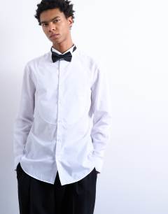 Model wearing Slim fit long sleeve tuxedo shirt with bib in white