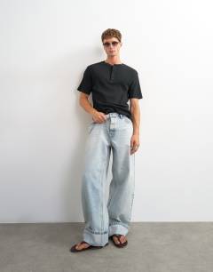 Model wearing Slim fit rib henley t-shirt in black