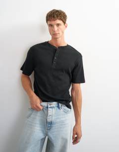 Model wearing Slim fit rib henley t-shirt in black